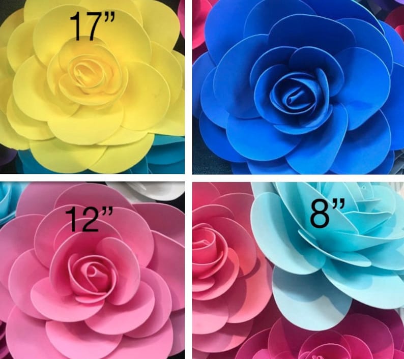 May include: Four paper flowers in different sizes and colours. The flowers are 17 inches, 12 inches, 8 inches, and 8 inches in diameter. The colours are yellow, pink, blue, and light blue.