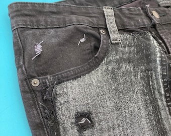 Vaqueros cosidos a mano reciclados con denim negro y plateado