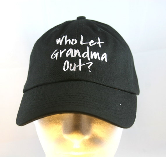 Who Let Grandma Out? (Polo Style Ball Black with White Stitching)