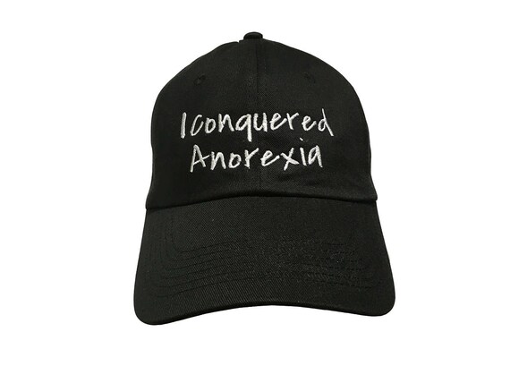 I Conuered Anorexia - Polo Style Ball Cap (Black with White Stitching)