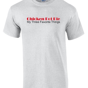 May include: A gray t-shirt with the text "Chicken Pot Pie My Three Favorite Things" in red.