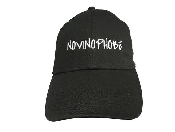 NOVINOPHOBE - Polo Style Ball Cap (Black with White Stitching)