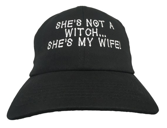 She's Not A Witch, She's My Wife!  (Embroidered Polo Style Ball Cap Available in Various Color Combos with White Stitching)