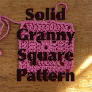 May include: A pink crochet granny square with the text "Solid Granny Square Pattern" in black.