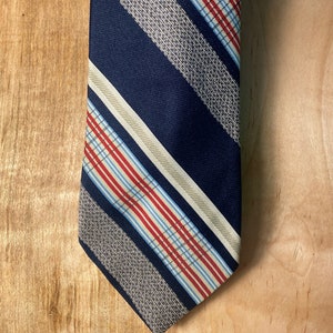 VTG 70's Striped Navy Polyester Tie / by Emilio Ferrara
