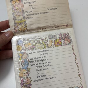 May include: Vintage babysitter's reminder pad with a colorful illustration of children and animals. The pad includes sections for emergency contacts, address, phone, and special instructions. The pad is sealed in plastic.