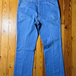 May include: A pair of light blue denim jeans with a straight leg fit.