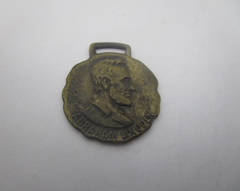 Antique Advertising Watch Fob Abraham Lincoln Youngstown Telegram Co