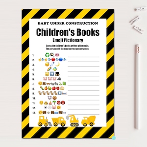 May include: A printable game card with a yellow and black striped background. The text "Baby Under Construction Children's Books Emoji Pictionary" is at the top of the card. The game instructions are to guess the children's books written with emojis. There are 13 lines with numbers 1 through 13 and emojis next to each number. At the bottom of the card are three yellow construction trucks.