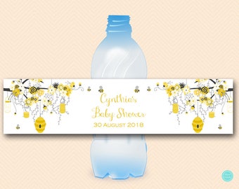 May include: A white baby shower water bottle label with a yellow and gray floral design. The label says "Cynthia's Baby Shower 30 August 2018".