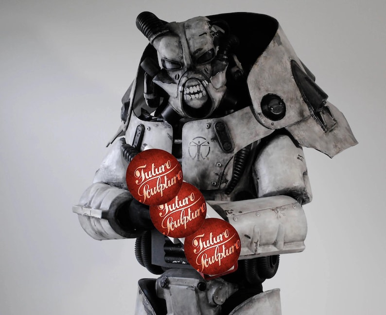May include: A white and gray robot wearing a helmet with a menacing expression, holding three red spheres with the words "Future Sculpture" written on them.