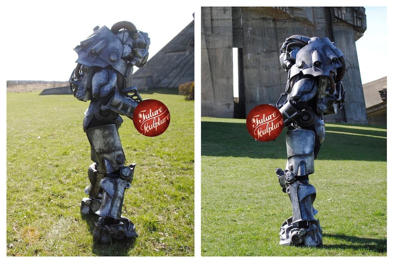 May include: A gray and silver robot costume with a futuristic design. The robot is holding a red sign that says "Future Sculptor".
