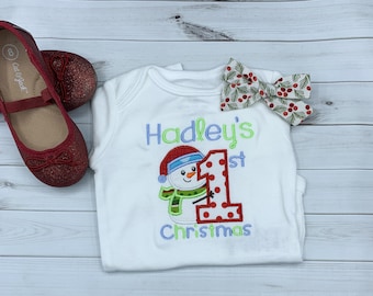 Baby girl's personalized first Christmas snowman bodysuit