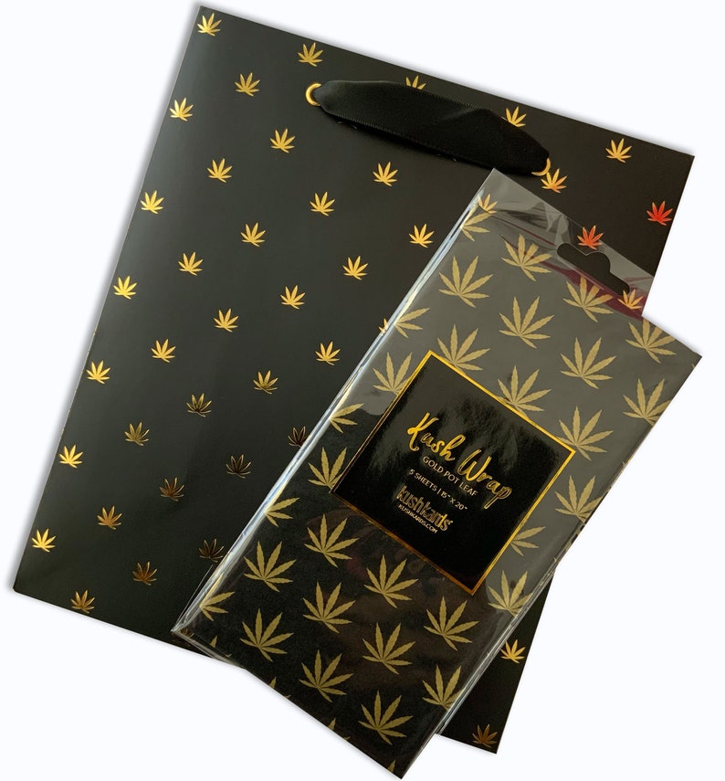 Black gift bag and matching gold pot leaf tissue paper combo set, perfect for elevated cannabis-themed gifting.