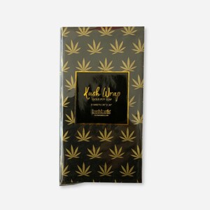 Pack of black tissue paper sheets with gold cannabis leaf pattern, labeled "Kush Wrap – Gold Pot Leaf.