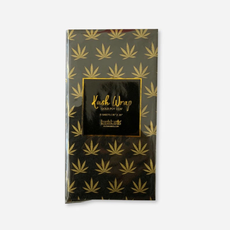 Pack of black tissue paper sheets with gold cannabis leaf pattern, labeled "Kush Wrap – Gold Pot Leaf.