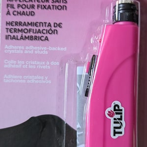 May include: A white ceramic mug with a black handle and the text "But First, Coffee" in a black, bold font. The mug is sitting on a wooden surface. The mug is approximately 4 inches tall.