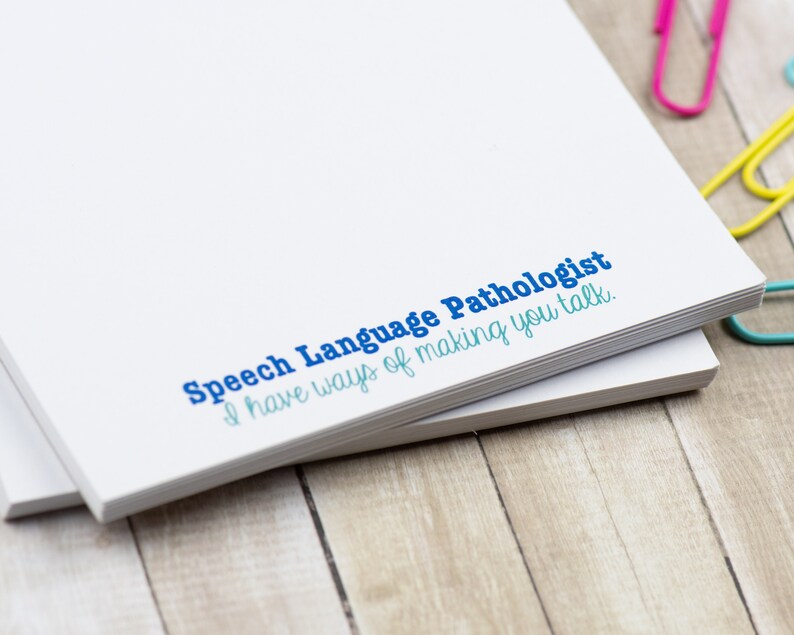 May include: A stack of white notepad paper with the text "Speech Language Pathologist I have ways of making you talk." printed in blue and teal.