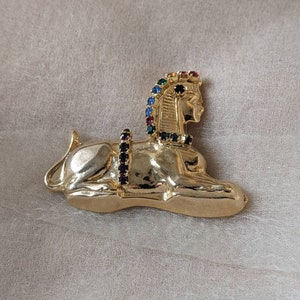 vintage egyptian revival sphinx pin brooch gold rainbow rhinestones Tutankhamun Ramses Africa African ancient archaeology mythology history