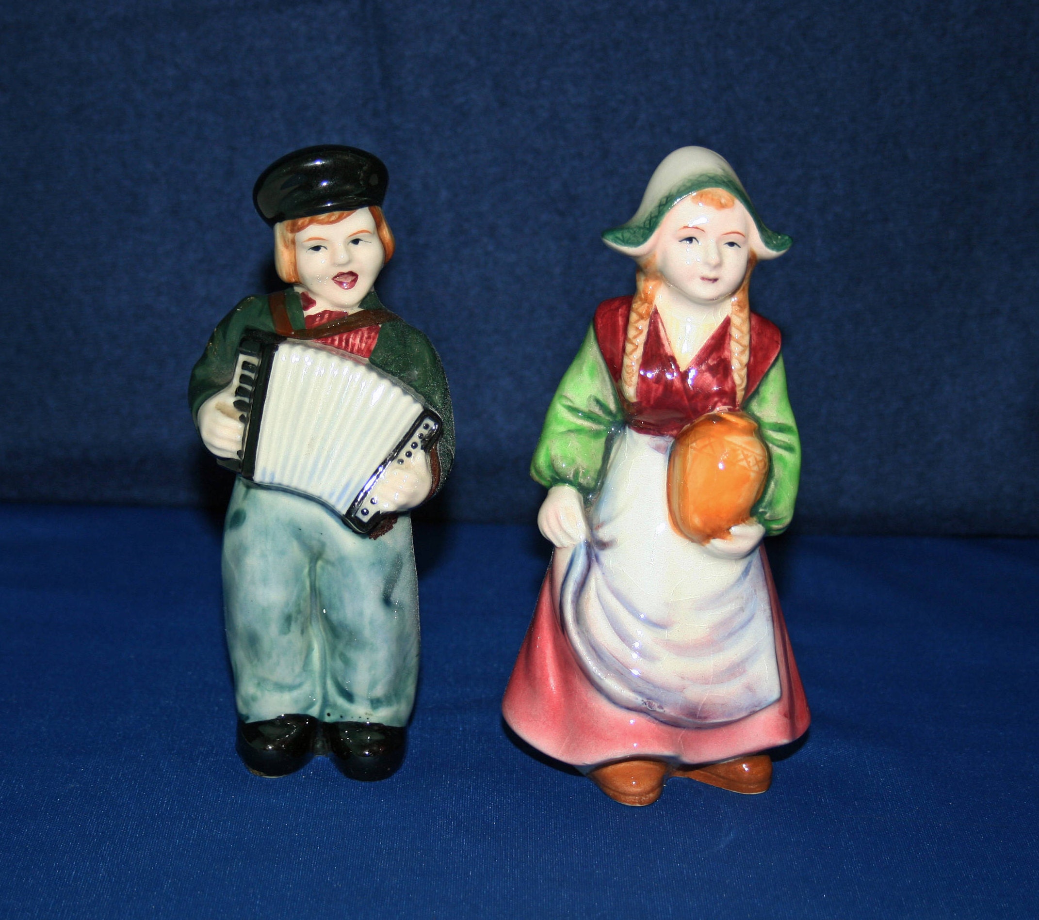 Vintage Dutch Boy playing Accordion and Girl with Jug Ceramic Pottery