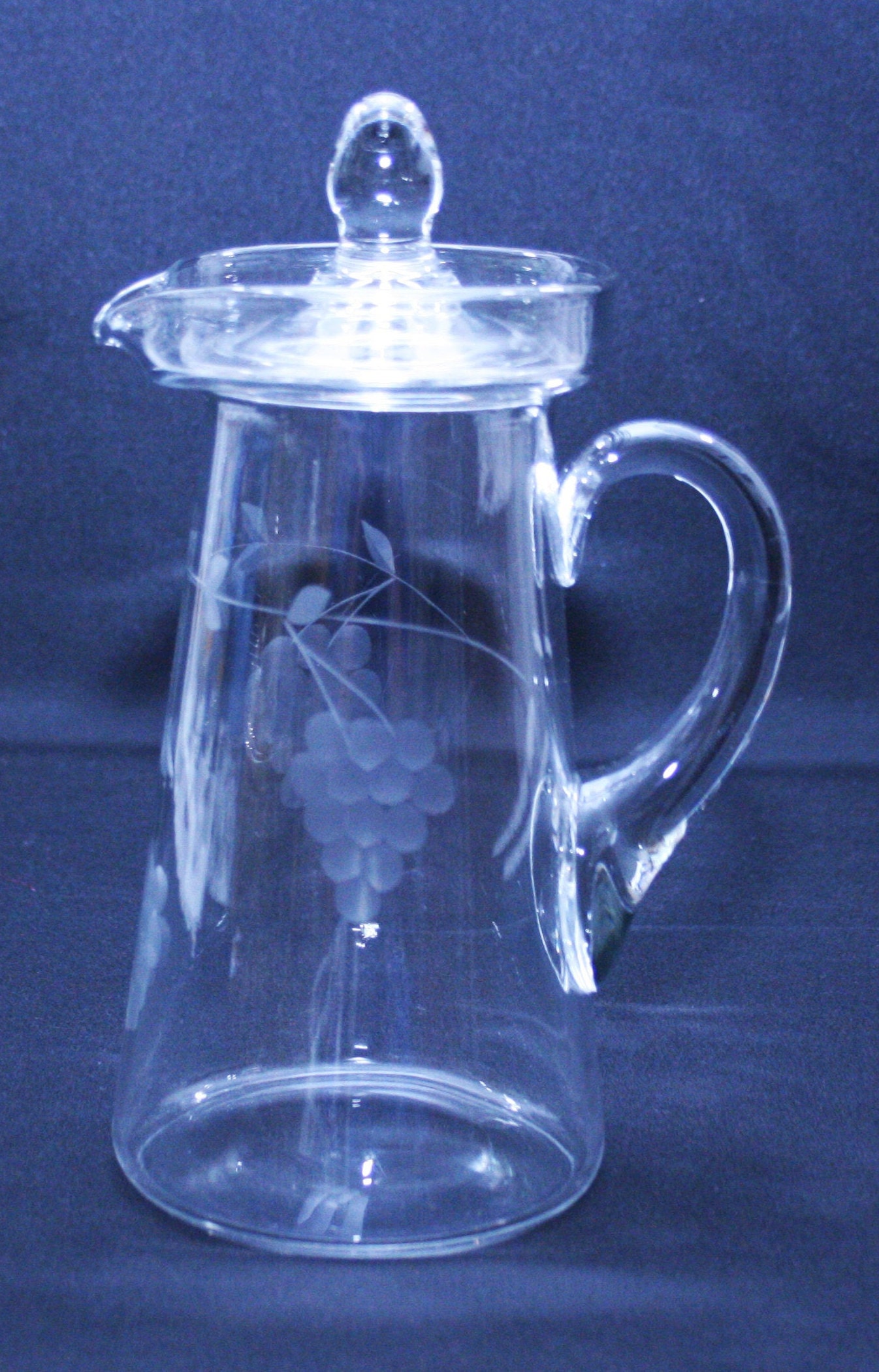 Antique Clear Glass Lidded Pitcher with Etched Grape Vine Motif