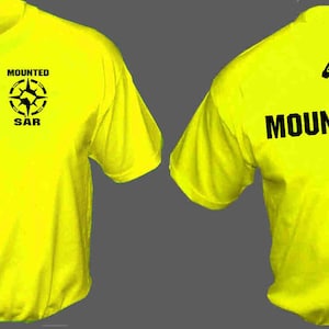 May include: A bright yellow t-shirt with a black horseshoe on the left sleeve and the text "MOUNTED SAR" and a black horseshoe on the back. The front of the shirt has a black compass with the text "MOUNTED SAR" above it.