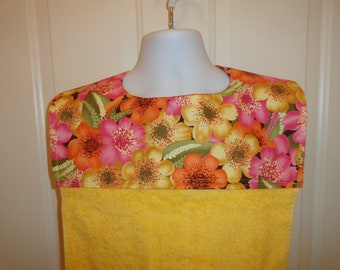 Adult bib, senior bib, clothing protector, bright yellow terry cloth, large golden and orange flowers, long to protect, reversible snaps