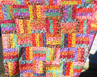 Unfinished quilt top, flower power/crazy daisies print, red, green, blue, yellow, brown, rail fence pattern, 56" x 65" cotton