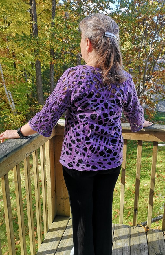 The felted wool tunic is double-sided. Very comfortable to wear, size 10-12.