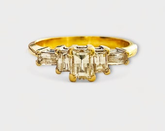 Modern 18ct gold baguette five stone diamond engagement ring