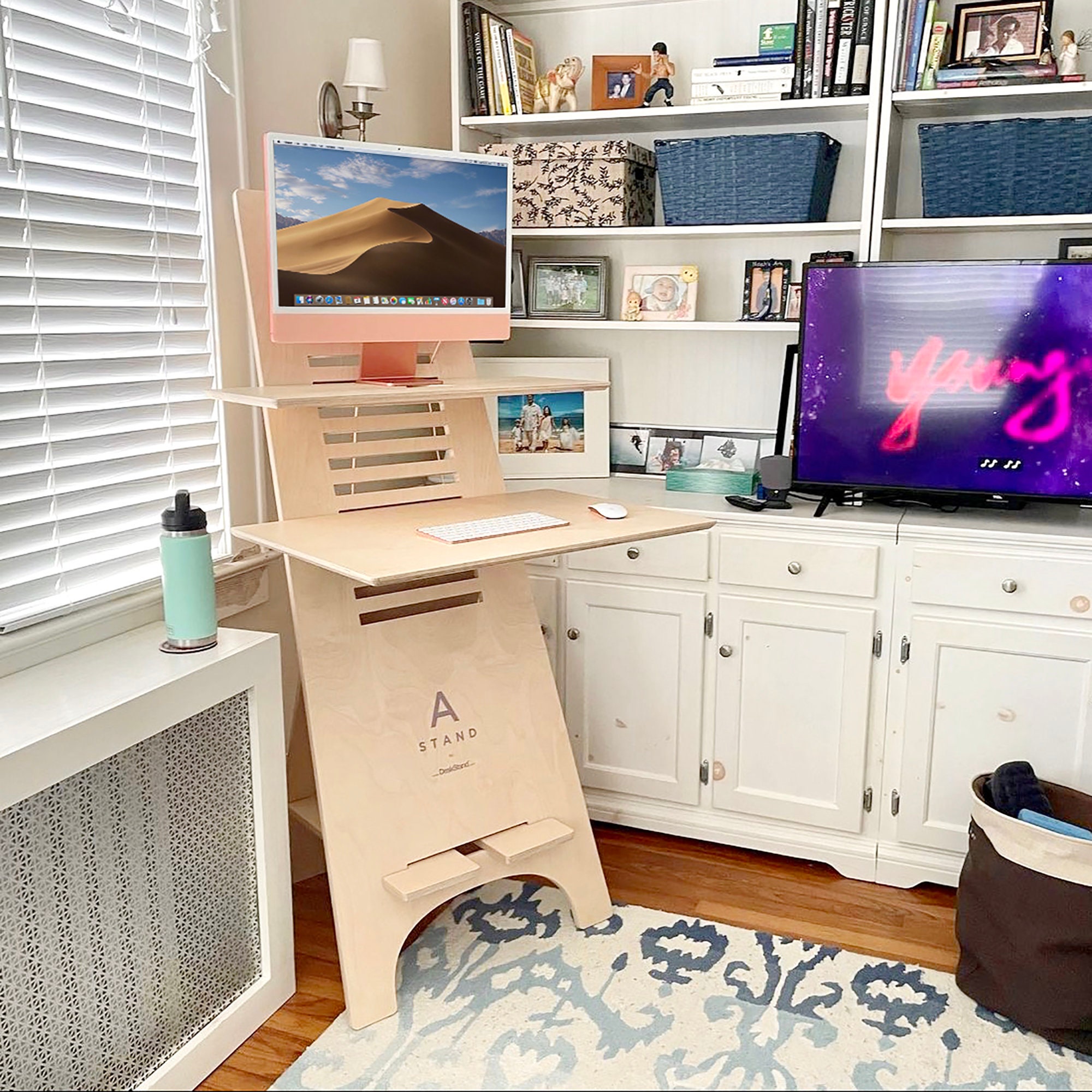 A stand Space Saving Standing Desk is Height Adjustable Mobile