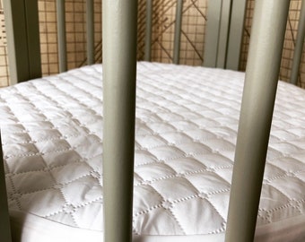 oval crib mattress protector