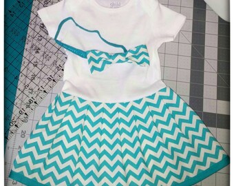 White and Teal Chevron Onesie Dress with bow. Size 3-6 MO