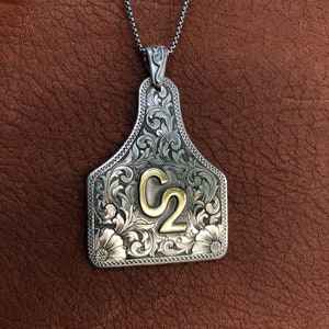 Sterling Ear Tag Pendant, hand engraved