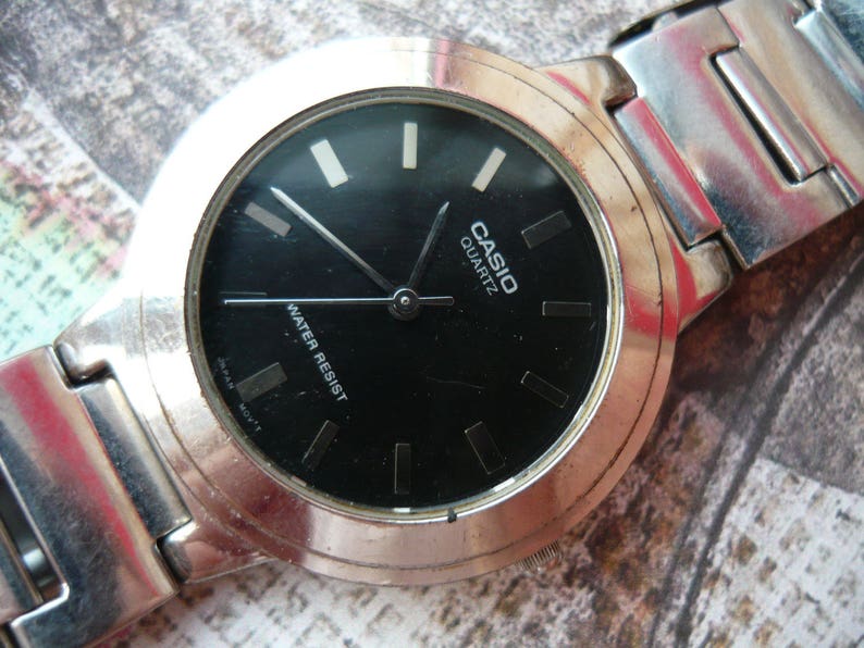 casio quartz water resist 100m manual