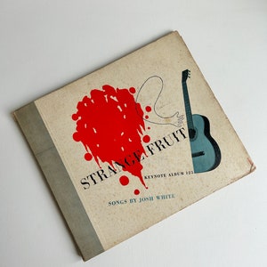 May include: A vintage vinyl record album cover with a red splatter design and the title "Strange Fruit" in red text. The album is by Josh White and is Keynote Album 125.