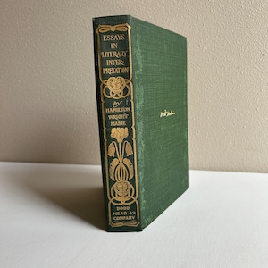 May include: A green hardcover book titled "Essays in Literary Interpretation" by Hamilton Wright Mabie. The book is published by Dodd, Mead & Company.