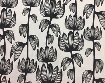 White tablecloth with black striped flowers and striped leaves, stylized flowers, modern style, black and white tablecloth
