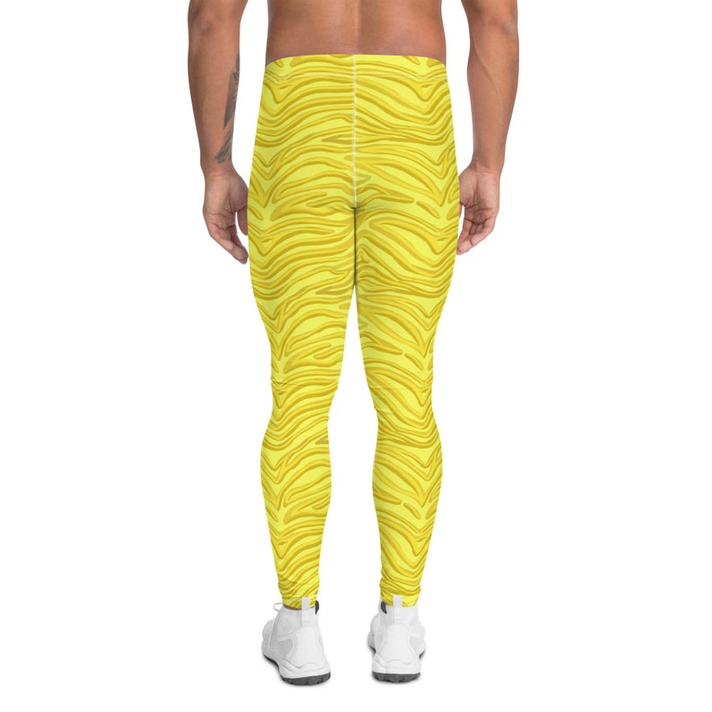May include: Yellow athletic leggings with a zebra stripe pattern.