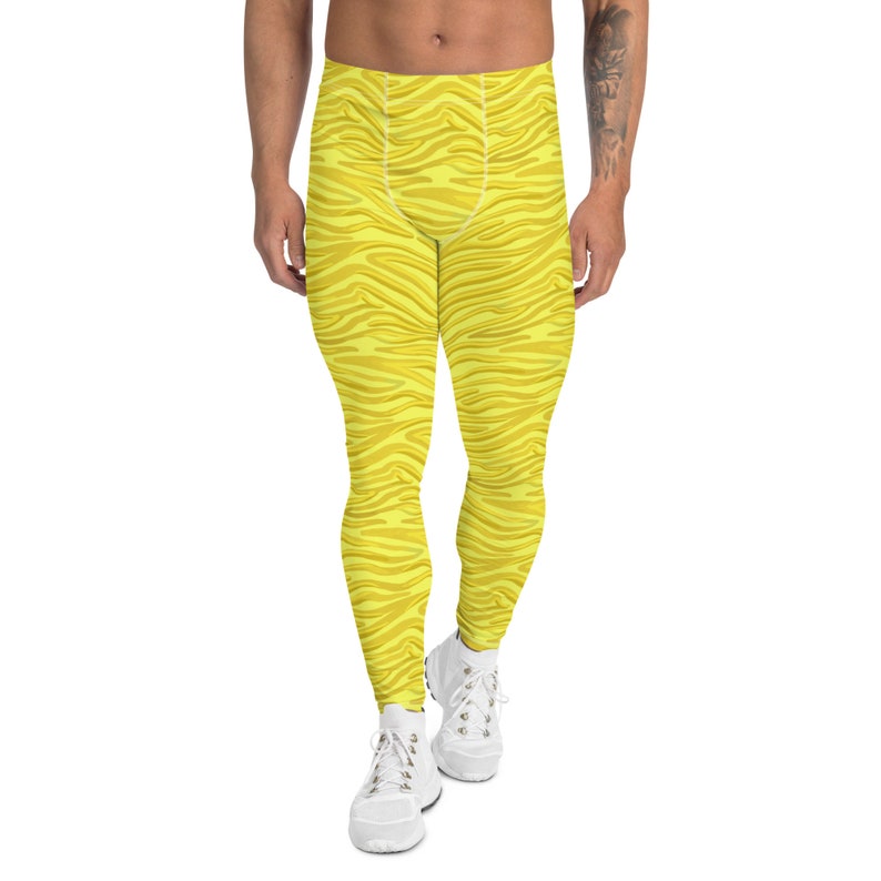 May include: Yellow athletic leggings with a zebra stripe pattern.