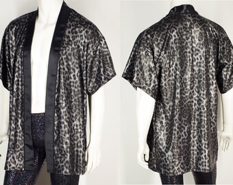 May include: A silver and black leopard print short-sleeved robe with a black satin trim.
