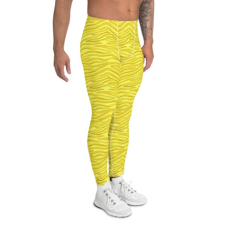 May include: Yellow athletic leggings with a zebra stripe pattern.