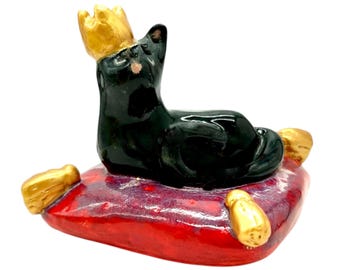 Ceramic Black Cat on a Red Pillow Sculpture with Gold Crown
