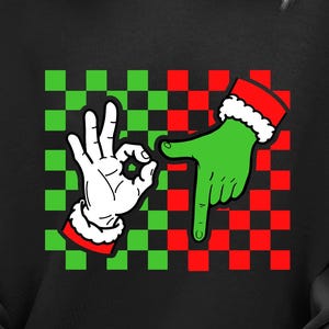 Op de afbeelding: Zwarte sweatshirt met een Grinch-thema ontwerp op een groen en rood geblokt patroon. Het ontwerp bevat een witte hand die het "OK" gebaar maakt en een groene hand met een rode kerstmuts die naar beneden wijst.