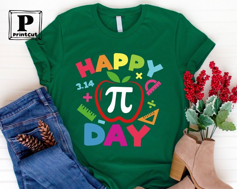 May include: Green t-shirt with the text "Happy Pi Day" in rainbow colors. The text is surrounded by a red apple with a white pi symbol and other math symbols.