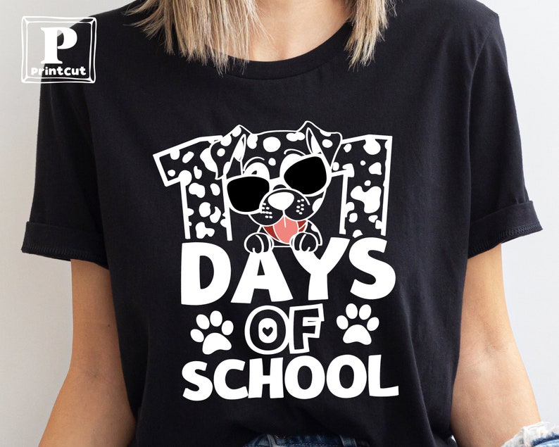 K&ouml;nnte beinhalten: Schwarzes T-Shirt mit einer wei&szlig;en Grafik eines Dalmatiners mit Sonnenbrille und dem Text "101 Tage Schule".