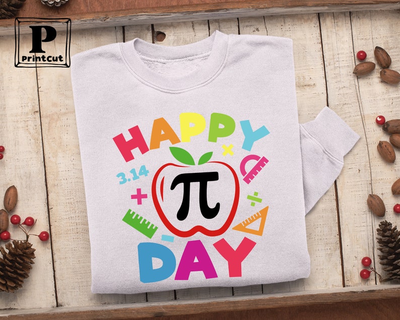May include: White sweatshirt with a colorful graphic design that says "Happy Pi Day" with a red apple with a black pi symbol inside.