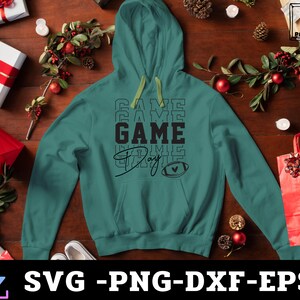 May include: Teal green hoodie with a black graphic that says "Game Day" with a football and heart design.