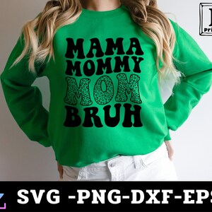 May include: Green sweatshirt with the text "Mama Mommy Mom  Bruh" in black with a leopard print design on the word "Mom".