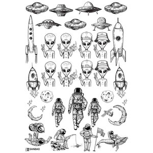 May include: Black and white illustration of aliens, spaceships, astronauts, and rockets. The illustration features a variety of alien characters, including some with peace signs, and a variety of spaceships, including flying saucers and rockets.